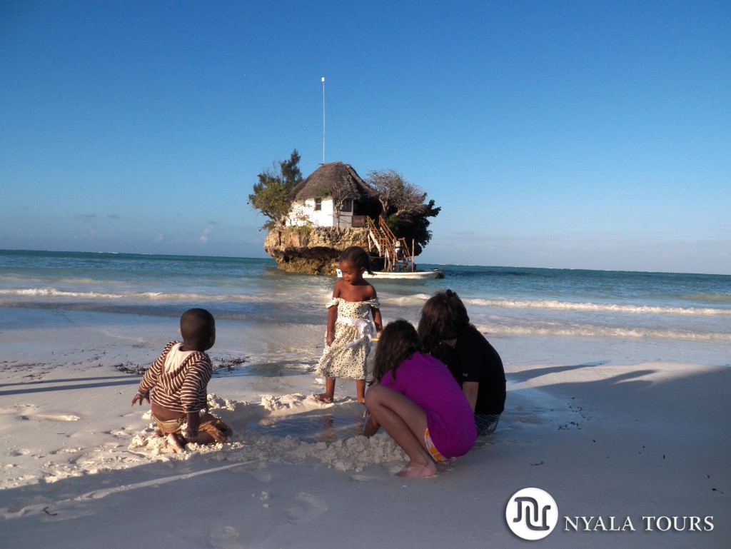 local-children-and-girls-playing-on-beach-the-rock